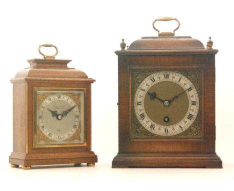 A mid 20th Century mahogany bracket clock, Roman numerals to a silver chapter ring, all below urn finials and carrying handle