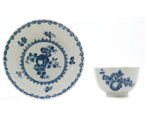 A late 18th Century Worcester teabowl and saucer decorated in the blue and white Fruit and Wreath pattern, crescent marks to 