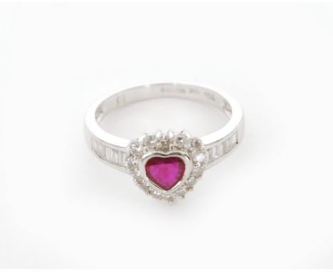 A contemporary 18ct hallmarked white gold ruby and diamond cluster ring, central heart shaped ruby within a brilliant cut dia