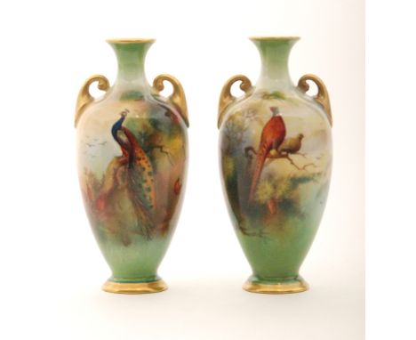 A pair of early 20th Century Royal Worcester twin handled shape H287 vases decorated by Bray, the first with a pheasant and g