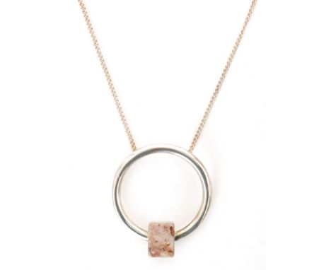 A Scottish hallmarked silver circular open work pendant set with pink marble panel, all to a silver curb chain, length 60cm, 