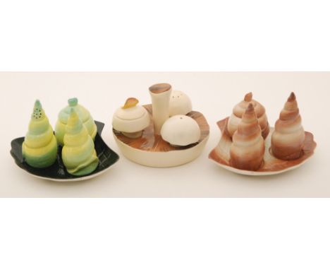 Three assorted novelty Carlton Ware cruet sets comprising two formed as shells and one as a mushroom, all with printed marks 