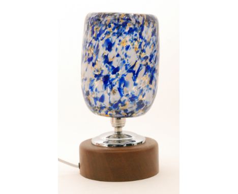 A 20th Century French glass table lamp, the cup shaped shade marbled in amber, white and blue mounted on a circular wooden ba