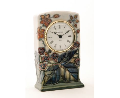 A Moorcroft Pottery mantel clock decorated in the Bramble pattern designed by Sally Tuffin, impressed mark (the clock movemen