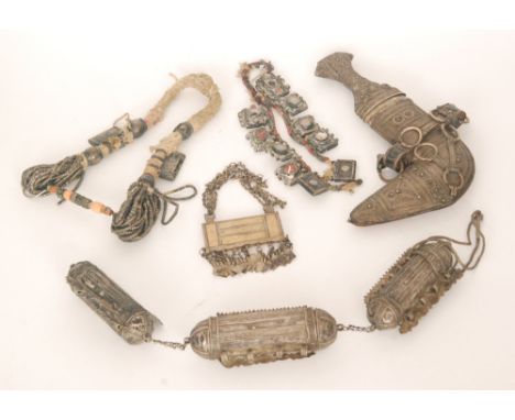 A white metal Eastern dagger and scabbard and various jewellery, necklaces, etc. (qty)