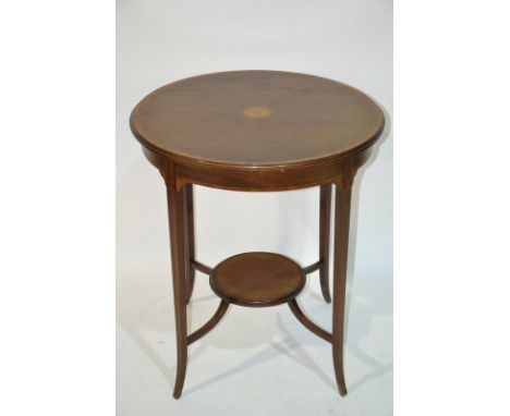 An Edwardian inlaid mahogany occasional table of circular form, with inlaid flower head central paterae to the top, raised to