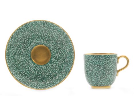 A 1920s Royal Worcester cabinet cup and saucer decorated with a textured shagreen effect finish, puce mark with date code for