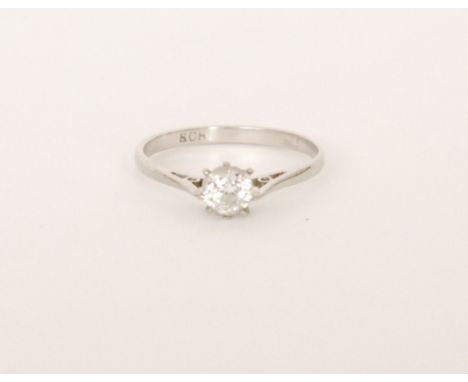 A platinum hallmarked diamond solitaire, old cut, claw set stone to knife edged shoulders, weight of stone approximately 0.33