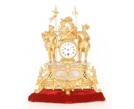 A late 19th Century French gilt mantle clock, the white enamelled dial flanked by two conquistador figures on an alabaster ba