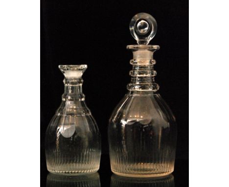 A William IV clear crystal decanter of club form with three rings and broad panel cutting to shoulders and base, height 18cm,