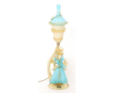 A Murano Venetian Glass Company glass lamp formed as a dandy and his beau, the figures in blue cased over white and amber, wi