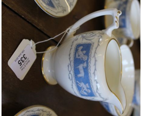 A Coalport forty-piece tea and coffee service in the Revelry range with blue and white classical depictions and gold rims £40