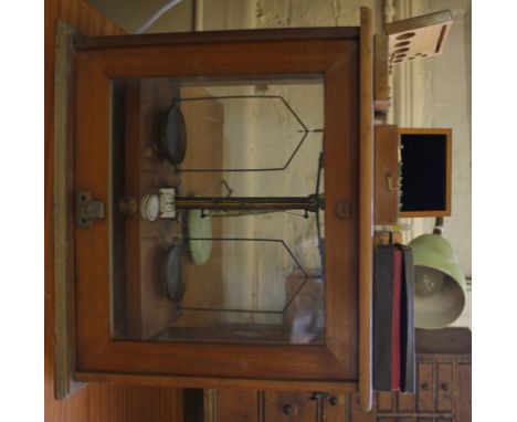 An A Gallenkamp and Co, Ltd, London scientific weighing scales in a mahogany framed glass case, etc £40-60