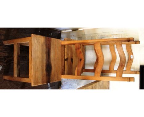 A set of four contemporary pine dining room chairs with dome shaped ladder back supports, raised on square legs with stretche