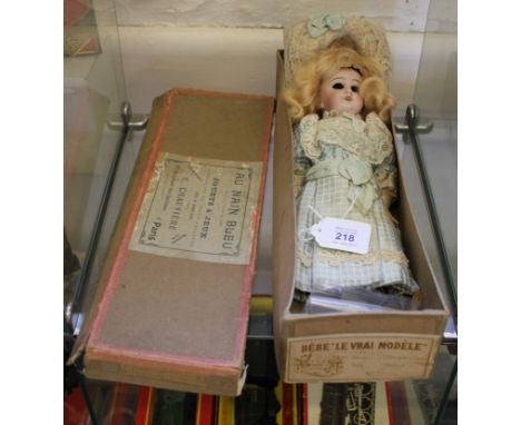 A French bisque head doll in original Au Nain Bleu (blue dwarf) Paris retailer's box, 28cm, eyes dislodged £60-80