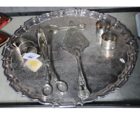 A pair of Birmingham silver engine turned napkin rings, a second set of silver plated napkin rings, a circular tray with a ca