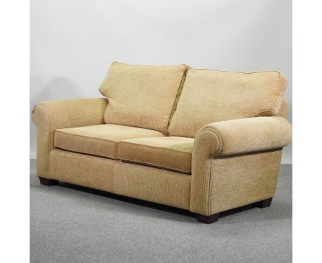 A beige upholstered sofa, 178cm