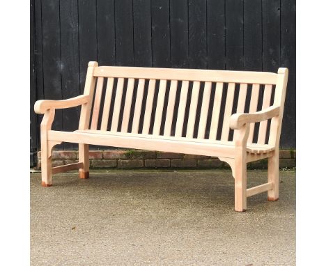 A teak slatted garden bench, with a loose cushion, 180cm