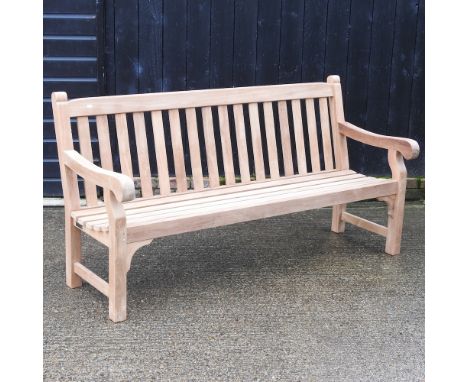 A teak slatted garden bench, with a loose cushion, 180cm