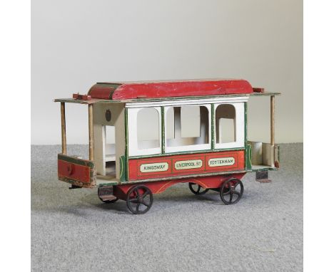 A vintage painted wooden model tram, 60cm