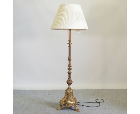 An ornate mid 20th century brass standard lamp and shade, 152cm high