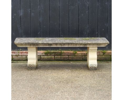 A reconstituted stone garden bench, 136cm