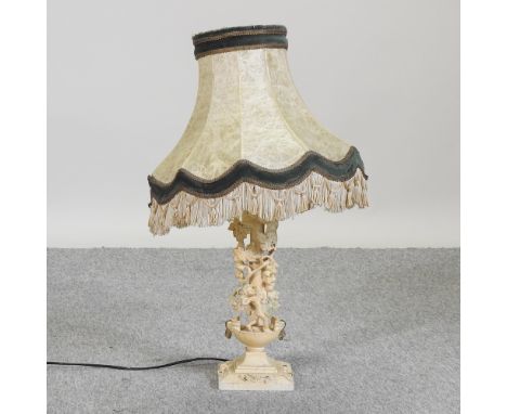 A cream painted table lamp and shade, 70cm high overall