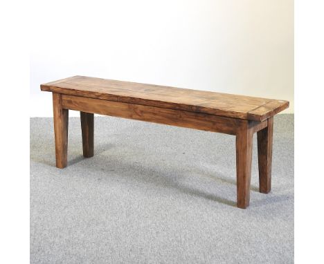 A rustic pine bench, on square tapered legs, 133cm