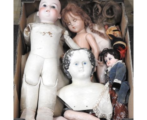 A bisque headed doll, together with various other dolls