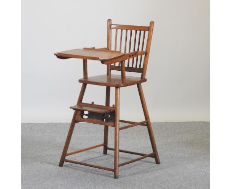 A 20th century oak child's stick back high chair