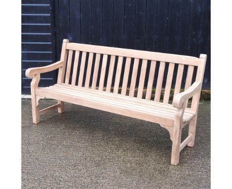A teak slatted garden bench, with a loose cushion, 180cm
