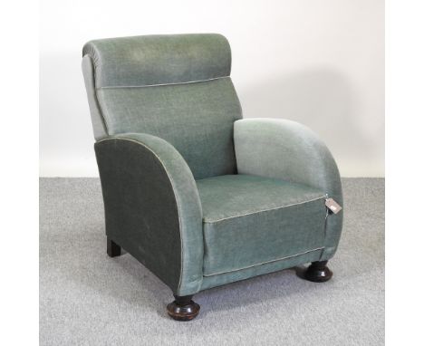 An Art Deco green upholstered armchair