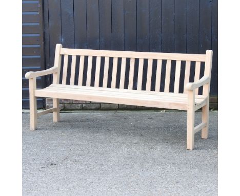 A teak slatted garden bench, with a loose cushion, 180cm