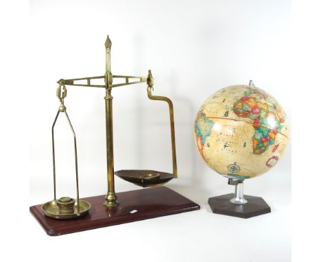 A set of mid 20th century brass scales and weights, together with a globe on stand, 42cm high