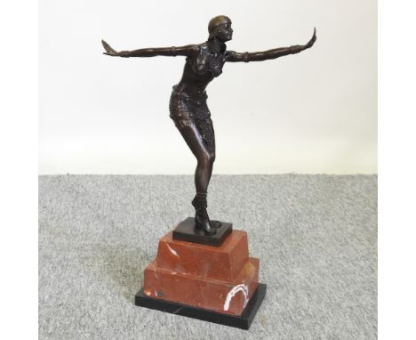 An Art Deco style bronze figure of a lady, on a marble base, 49cm high