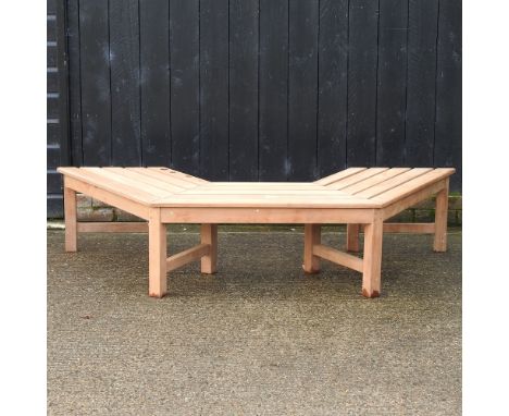 A teak shaped half tree garden bench, 190cm