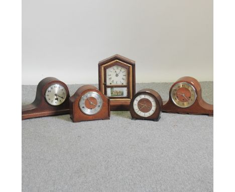 An early 20th century mantel clock, together with four others, tallest 38cm