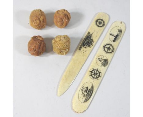 A modern bone page turner, 17cm, together with four carved netsuke
