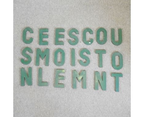 A set of vintage green painted metal advertising sign letters, each 25cm high