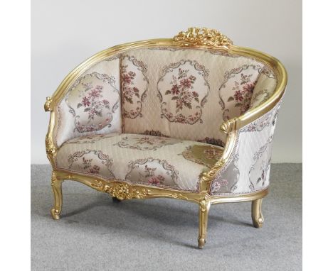 A French style gilt framed pink floral upholstered sofa, 122cm