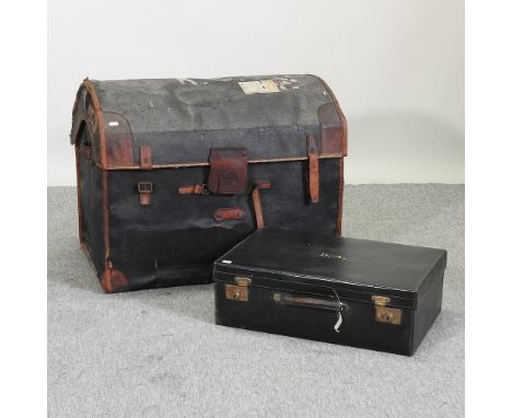 An early 20th century dome top trunk, together with a leather suitcase