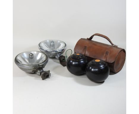 A pair of vintage chrome Jaguar spotlights, together with a vintage bowls set, in a leather case