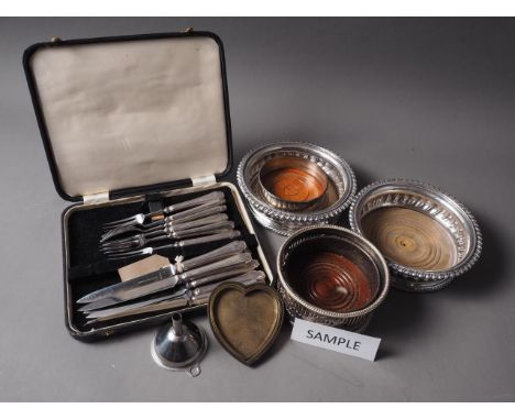 Two pairs of silver plated bottle coasters, a cased set of fruit knives and forks, and various other flatware 
