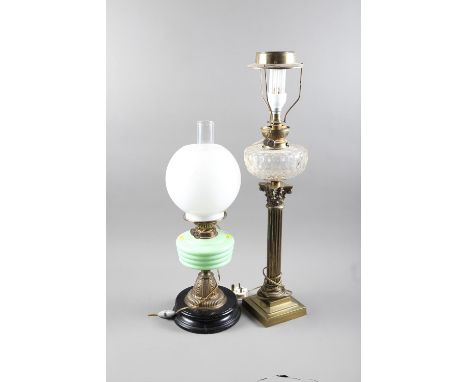 An early 20th century brass oil lamp with Corinthian column and faceted clear glass reservoir, on square stepped base, 22" hi