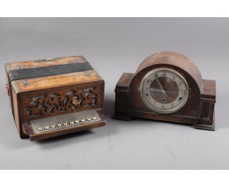 A maple and marquetry banded accordion, and an oak cased mantel clock with silvered dial and Arabic numerals 