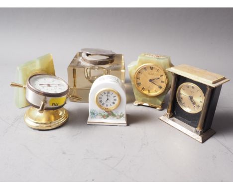 A square-shaped glass inkwell with silver collar (collar loose), 3 1/4" high, three miniature mantel clocks and two similar t