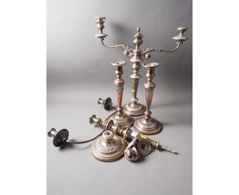 A pair of silver plated three-light candelabra and two similar single-light candlesticks 