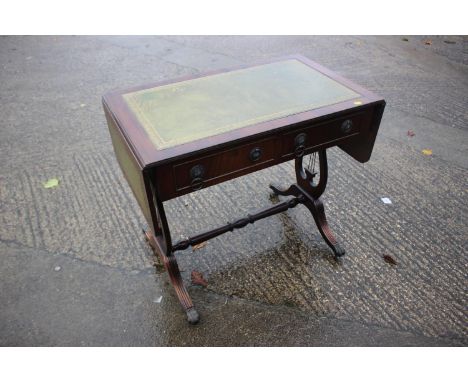 A mahogany sofa table with tooled lined top, fitted two drawers, on liar end splay supports, 34" wide x 20 deep x 29" high 