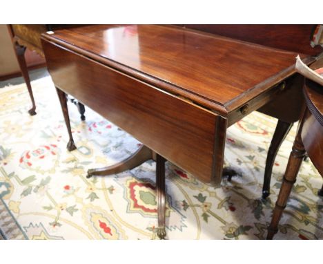 A mahogany sofa table, fitted single drawer, on brass claw and castored splay supports, 42" wide x 21" deep x 28 1/2" high 