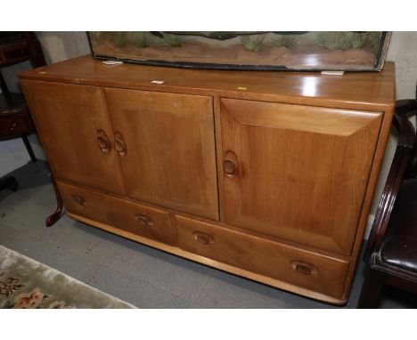 An Ercol natural elm sideboard, fitted three cupboards over two drawers, 51" wide x 18" deep x 30" highNormal wear for age, i